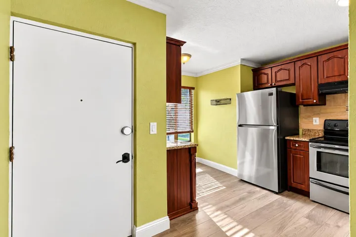 Bright Kitchen Entryway with Warm Wood C