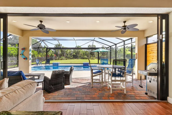 Draw back the stacking glass doors and let an ordinary lunch become an afternoon beside the pool