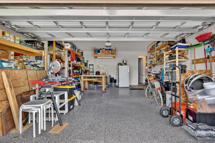 THE GARAGE IS EXTRA DEEP, 4 FEET MORE THAN A STANDARD GARAGE, IT CAN ACCOMMODATE A BOAT TRAILER 18 FEET LONG, THE EPOXY FLOOR PROVIDES LASTING PROTECTION, AND DUST FREE ENVIRONMENT