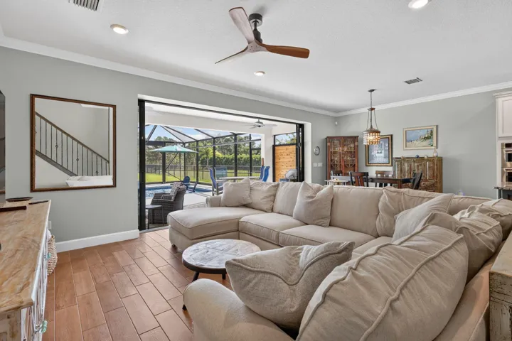 Open the glass doors and let the living room, lanai and pool become the setting for an unhurried afternoon