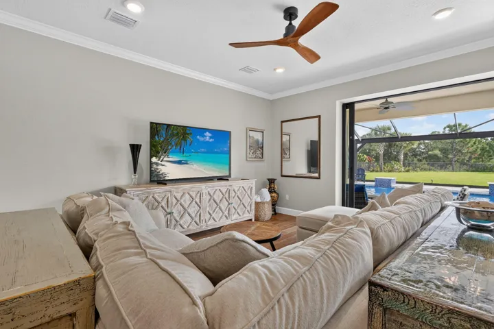 From the island to the living room, the open layout keeps the host in the conversation and everyone part of the occasion.