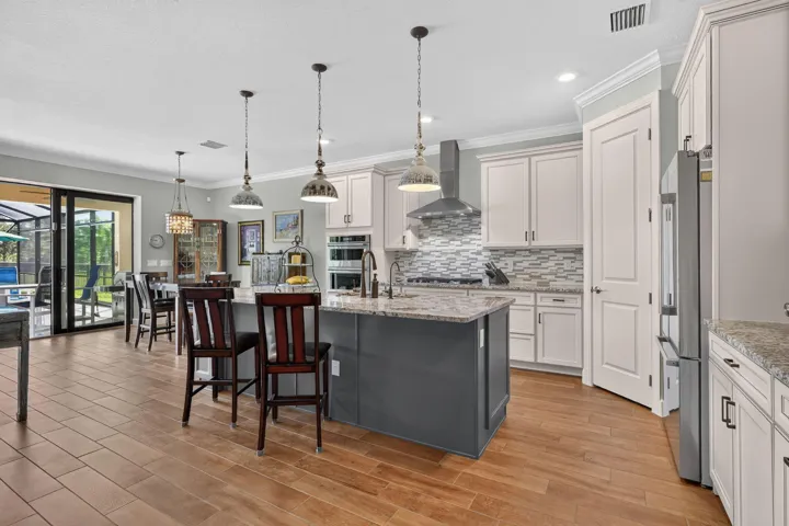 Rich cabinetry and striking tilework give the bath its elegance, with generous counter space for an unhurried start.