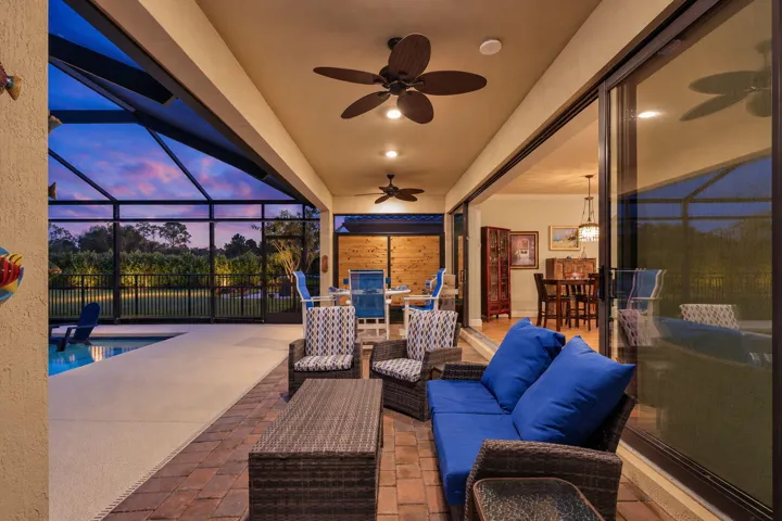 The pool shimmers, the landscape glows, and the preserve beyond gives the evening a beautiful sense of escape