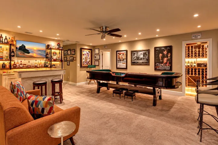 After dinner, take the gathering upstairs. A spacious entertainment loft and adjoining wine room give the evening another chapter