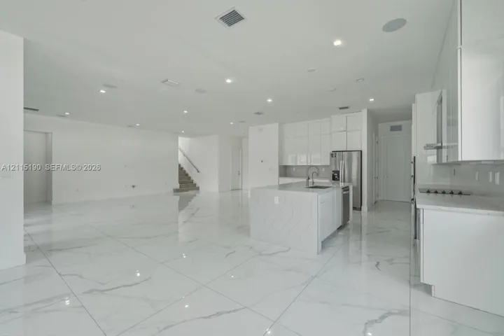 Island kitchen overlooking the living area.