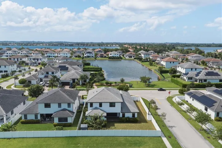 Rear aerial view of the home and neighborhood.