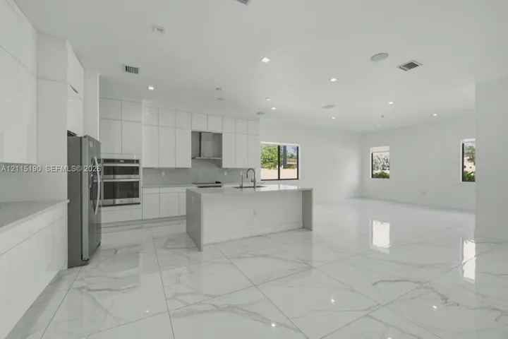 Kitchen island and surrounding cabinetry.