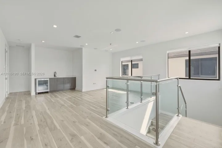 Upstairs loft with wet bar and beverage refrigerator.