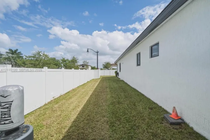 Fenced side yard.