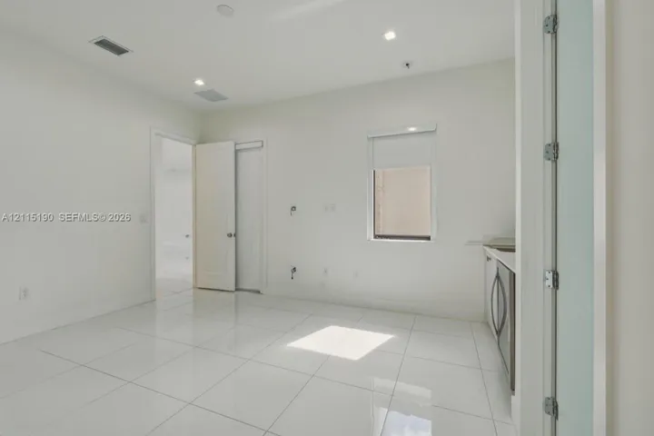 Additional living area with wet bar.