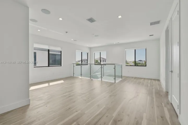 Upstairs loft and glass railing.