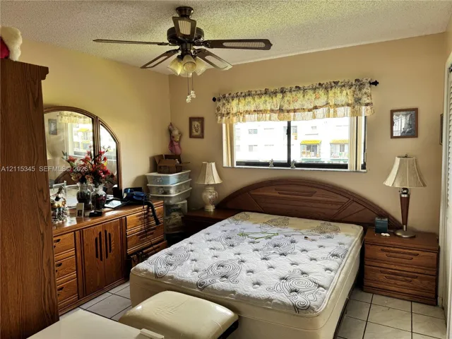 Tiled flooring, ceiling fan with integrated lighting, and horizontal sliding window