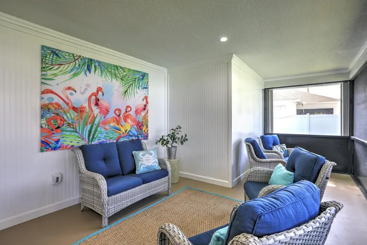 Enclosed porch featuring beadboard wall paneling, crown molding, recessed lighting, and screen-enclosed windows