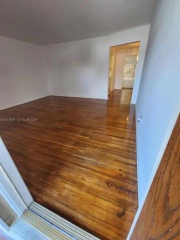 Refinished wood-finish flooring with neutral wall tones