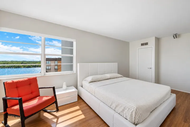 Waterfront Bedroom with Terracotta Chair
