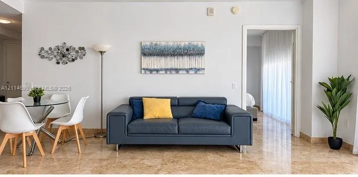Polished stone flooring, smooth wall finishes, and clean architectural lines