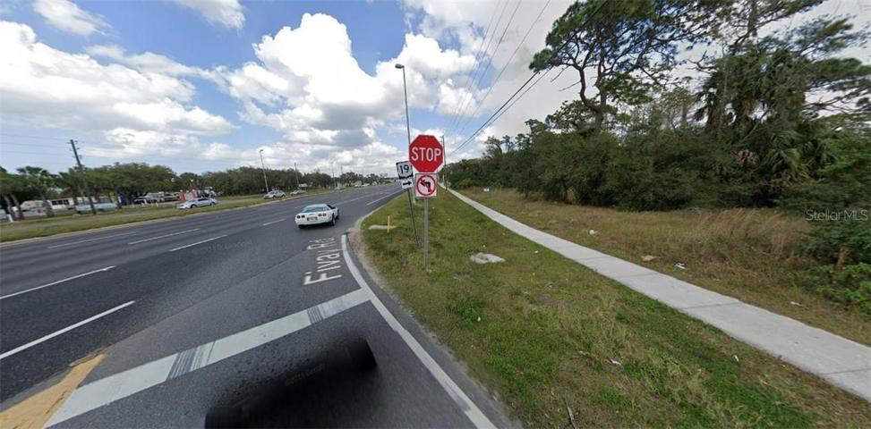 VIEW OF THE ROAD FRONTAGE ON THIS TRACT, EXITING FIVAY RD ONTO HWY 19.