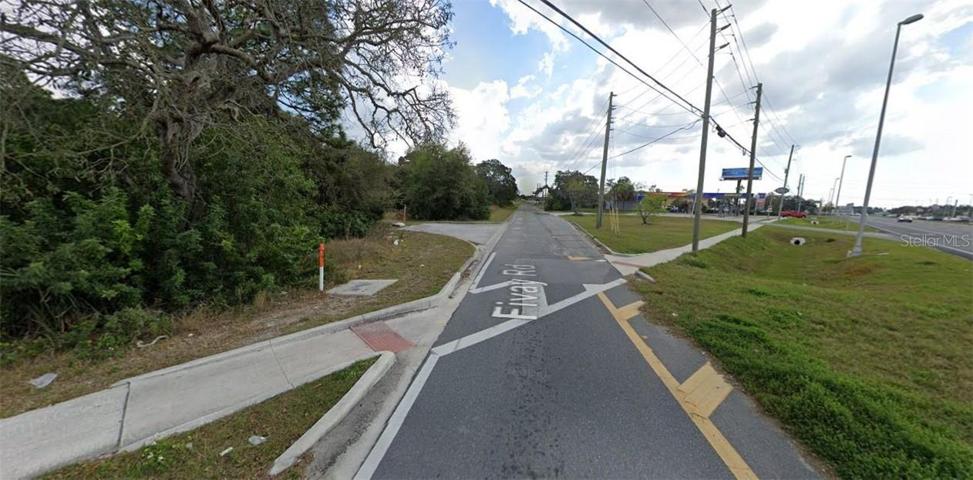 VIEW OF PROPERTY ON THE LEFT SIDE OF PHOTO, OFF THE CORNER OF HWY 19 AND FIVAY RD