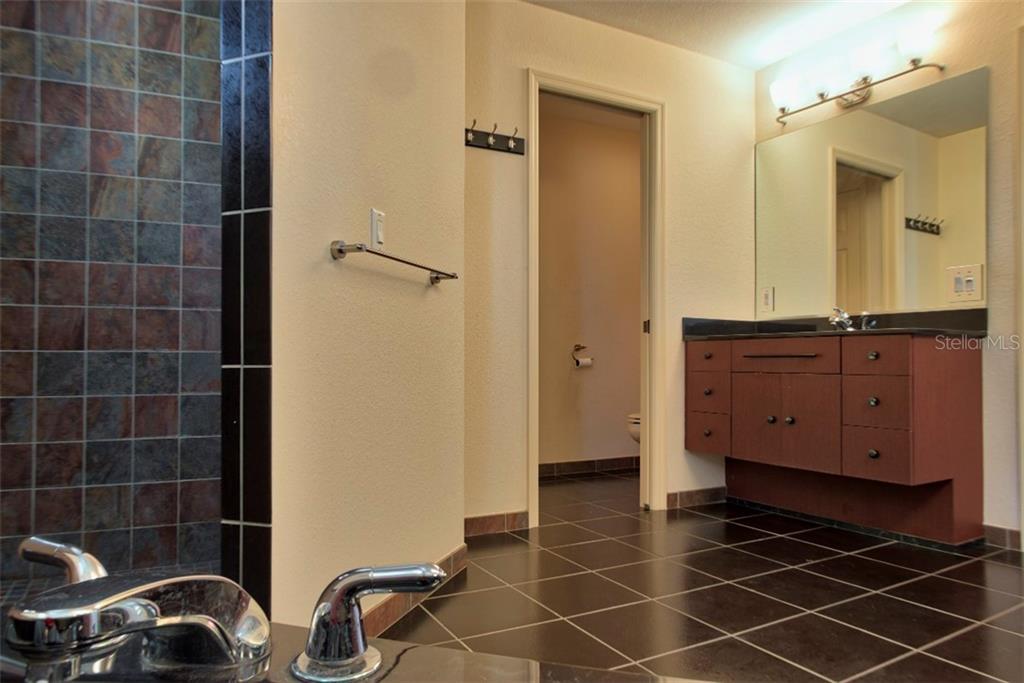 Separate sinks and pocket doors.