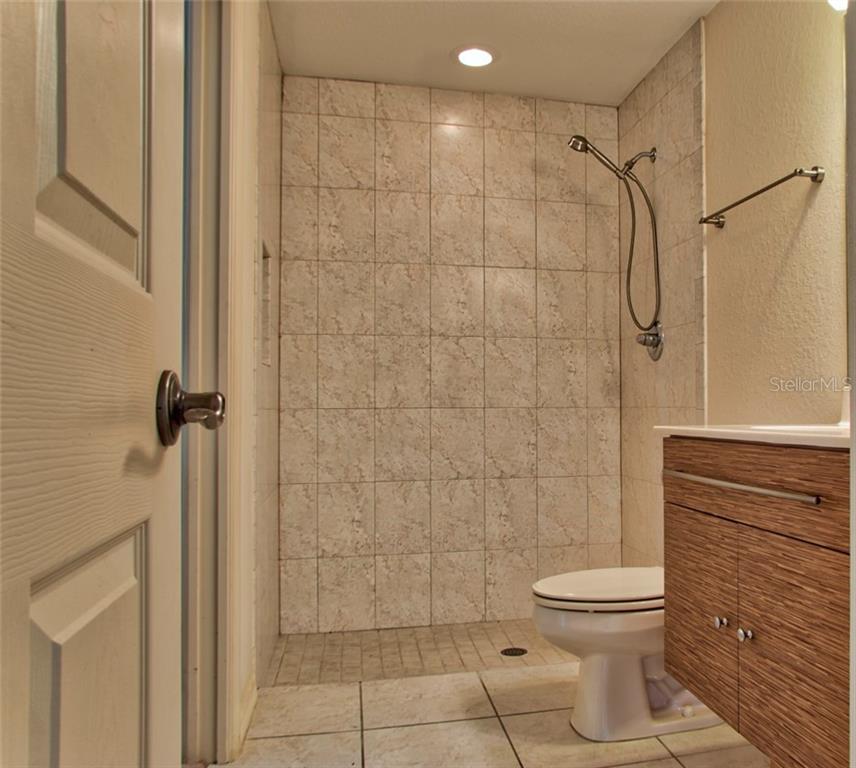 Third bathroom tile shower.