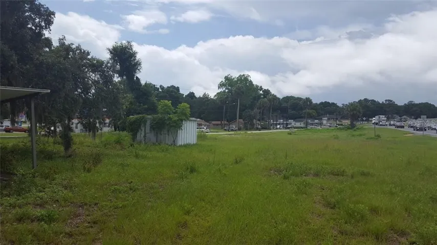 North end of the property.  Old shed from a shed company still on the property.  Hwy 301 Northbound traffic is headed towards me on the right side of the picture. SE 62nd Ave is to the far end of the property at this angle.