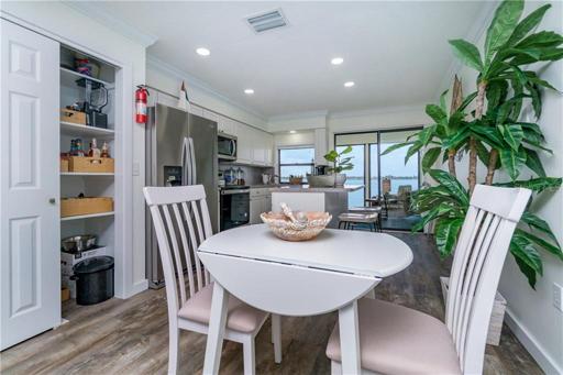 Just steps from the living room is the dining area/fully equipped kitchen.