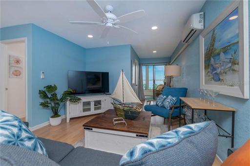 The cozy living room offers tranquil views of Lemon Bay.