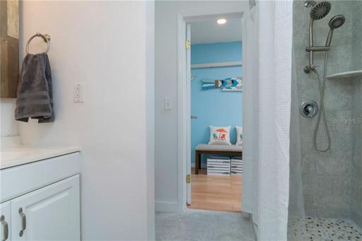 The bathroom offers an updated walk-in shower.