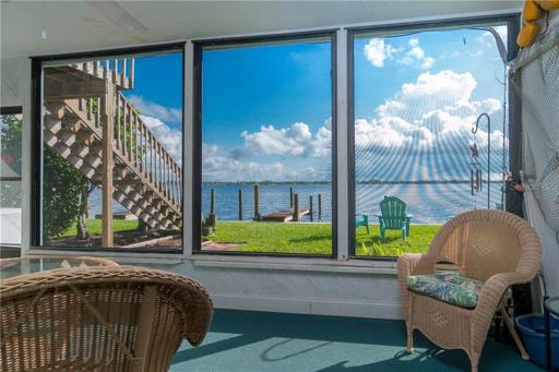 The screened lanai offers tranquil views of Lemon Bay.