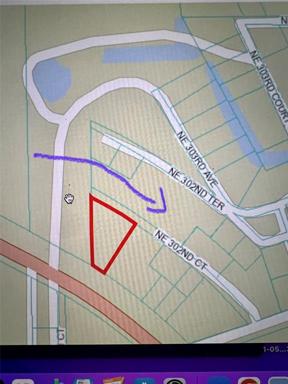 This is a NEIGHBORS physical address - for reference to where the property is. 9800 NE 302 terr