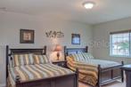 2nd upstairs bedrooom with 2 fQueen size beds and en-suite full bath