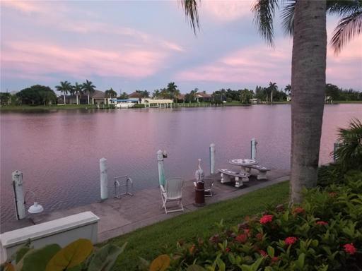 Canal view sunset sky from adjacent house.  THIS could be YOUR view too!
