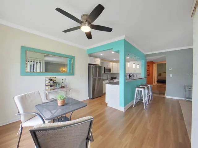 Looking back to the kitchen and foyer entry and down the hall to the bedrooms.