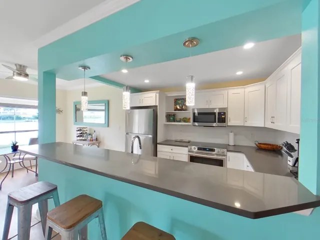 Wonderfully appointed kitchen with stainless appliances, bar seating!