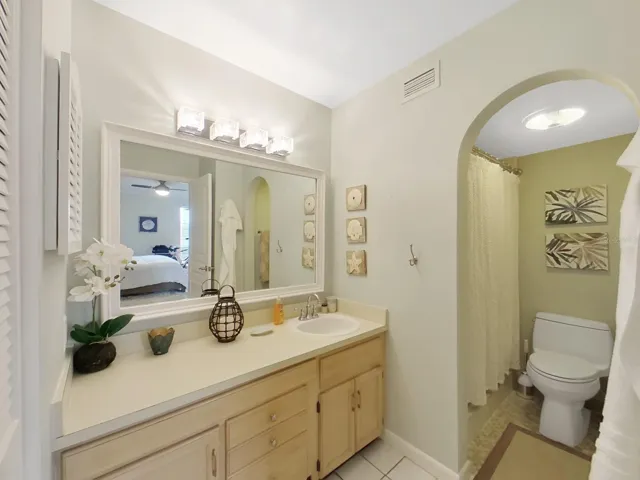 On-suite bath for main bedroom has separate shower and vanity area.
