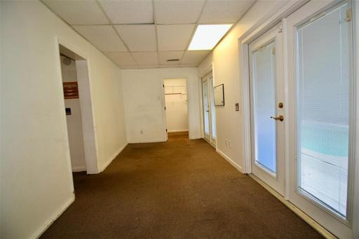 Family Room - doorway on left leads to kitchen, doorway ahead is 1/2 guest bath/laundry room