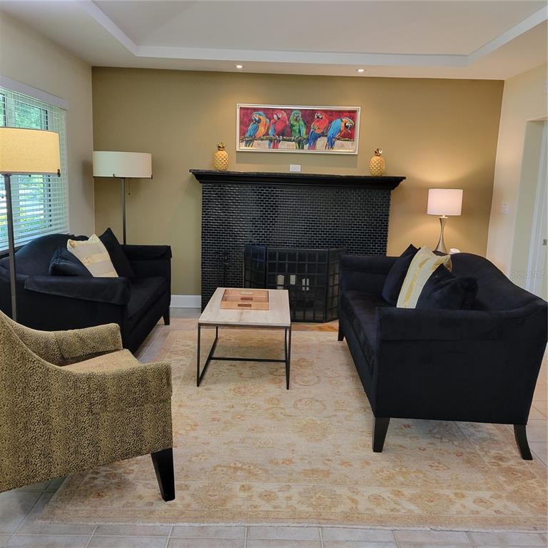 Living room with wood burning fireplace