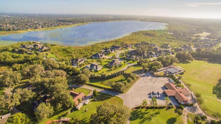 Club house parking lot with view of Lake Miona