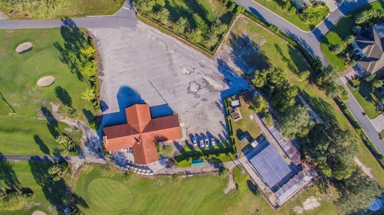 Club house, cart house, and roof top view