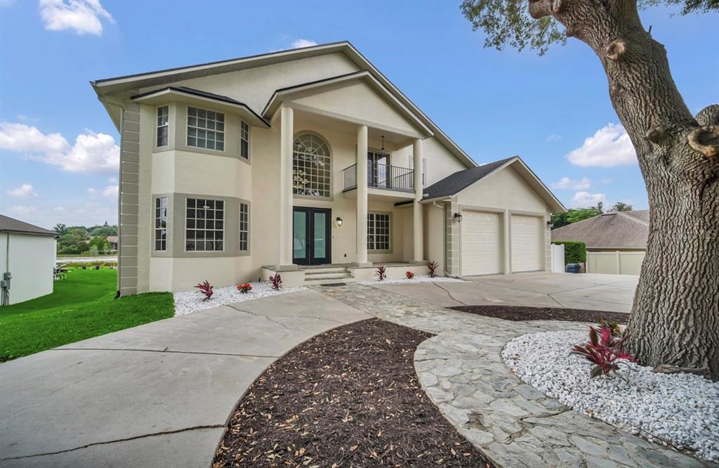 Circular driveway allows for easy access and plenty of guest parking along with oversized two car garage