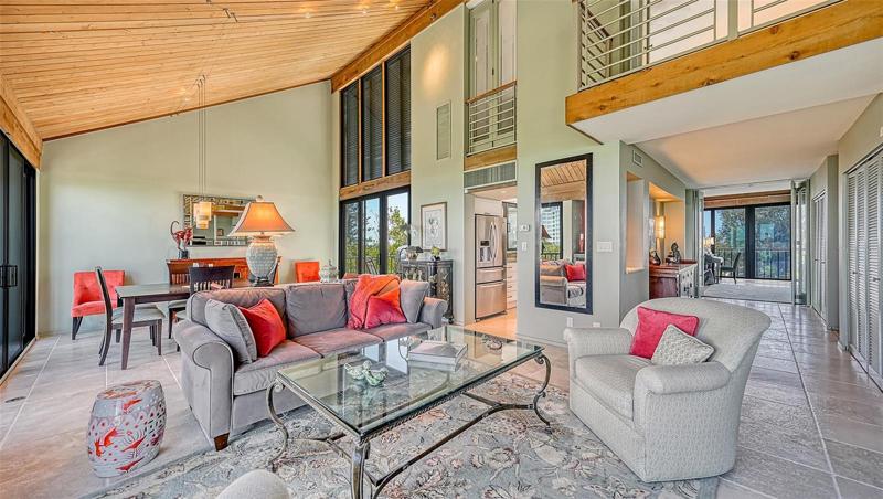 Looking toward the kitchen and past the entry to Bedroom #2 overlooking Cedar Lake
