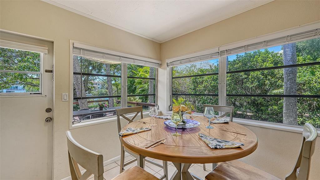 Dining room off  the kitchen with door to the backyard deck