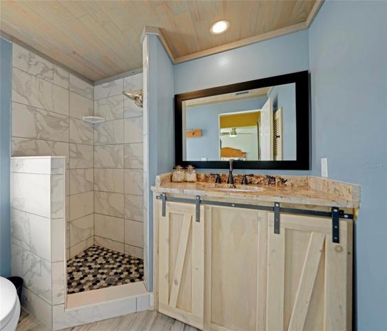Master Bathroom with marble to ceiling