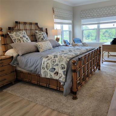 Master bedroom with sitting room overlooking water