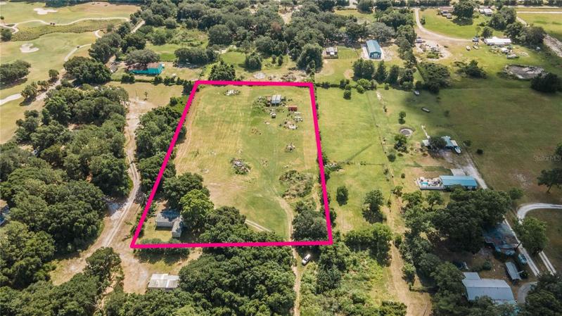 Aerial view of 4.05 acres with 3 bedroom 3 bath double wide mobile home