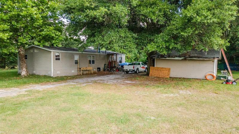 Front of house with extra storage shed