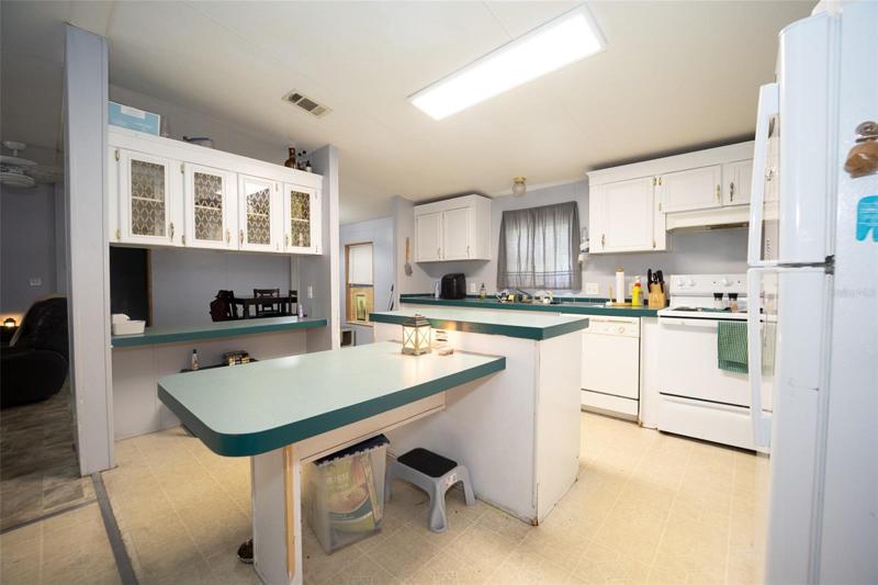 Kitchen with eat-in area and separate island