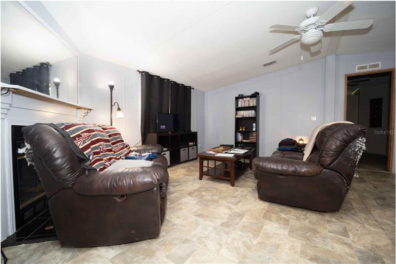 Living area with access to Bedrooms and Kitchen area