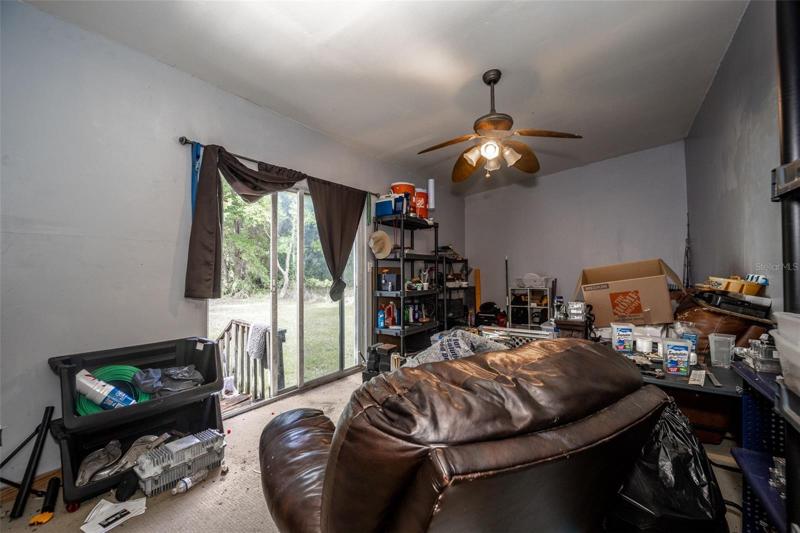 Spare room with sliding glass door to backyard