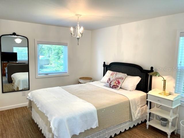 Queen size bed, closet and full length mirror
